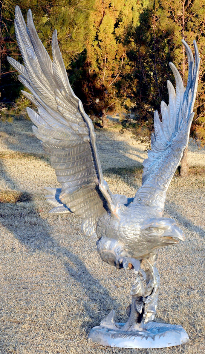 flying eagle statue with fish