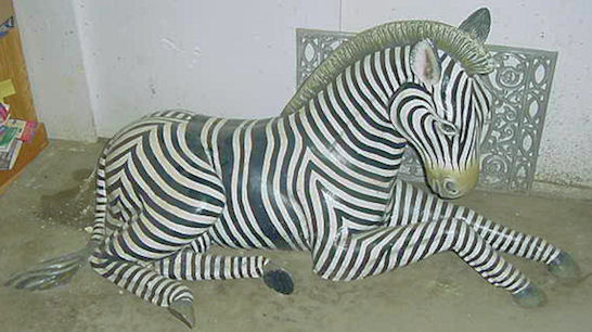 cast aluminum zebra laying down