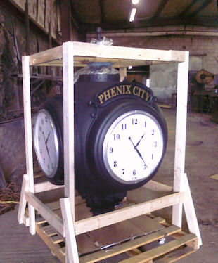 four dial clock case with arabic numerals
